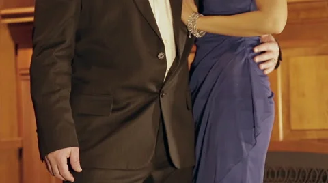Distinguished man looks at time and holds his date Stock-Footage 42890617
