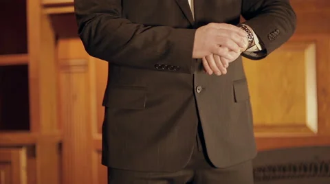 Distinguished man looks at the time Stock Footage 42890734