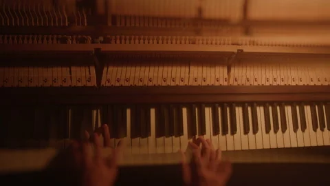Distorted Abstract Close-up of Person Playing Piano in Lamp Light From Above Stock-Footage 222005453