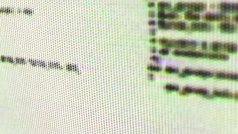 Distorted Abstract Macro Close up of Computer Screen with Scrolling Green Code Stock Footage 219603273
