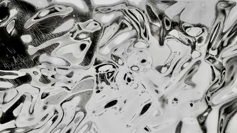 Distorted black and white metallic chrome texture with fluid ripples and scra Stock-Fotos