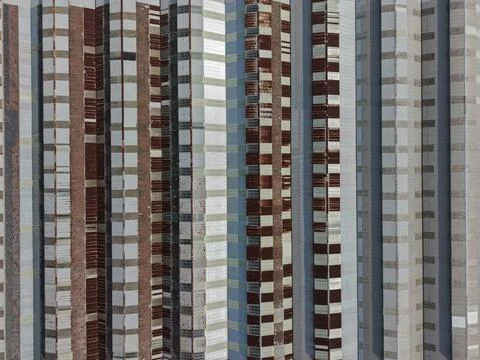 Distorted building facade creating abstract geometric pattern Stock Photos