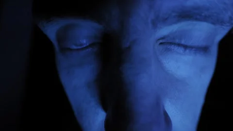 Distorted Face of Paranoid Man with Darting Eyes in Blue Light Stock-Footage 329923241