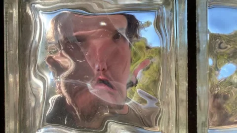 Distorted Face Speaking Through Warped Glass Stock Footage 274696284