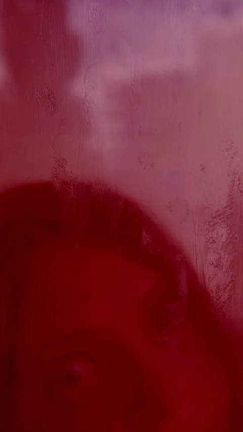 Distorted horror face behind red misted glass, blurry woman monster, Panic .. Stock Footage 313884423