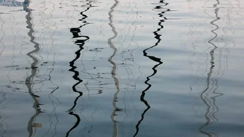 Distorted Mast Reflections in Water at Varna Marina Stock Footage 321929580