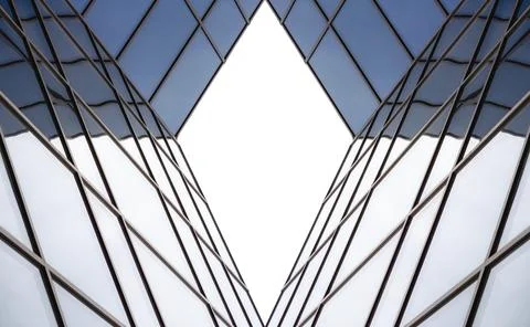 Distorted reflection in the mirrored windows of a modern building abstract Stock Photos