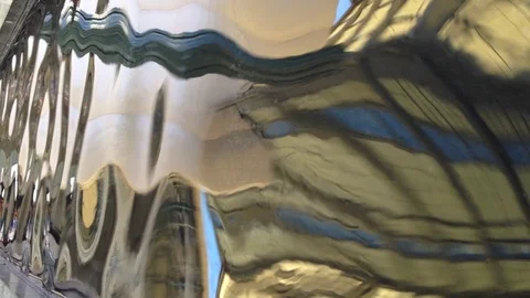 Distorted reflections of a building in water Stockbeeldmateriaal 90152479