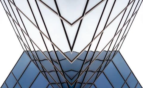 Distorted reflections in the mirrored windows of a modern building Stock Photos