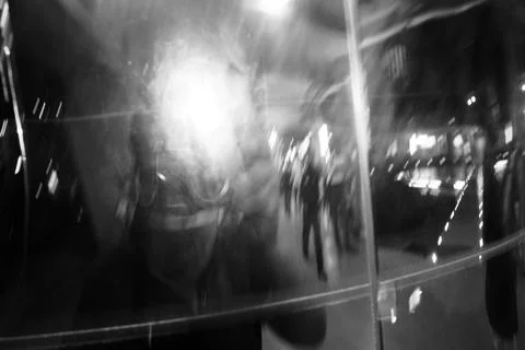 Distorted Self Portrait in Mirrored Surface After Dark Foto stock