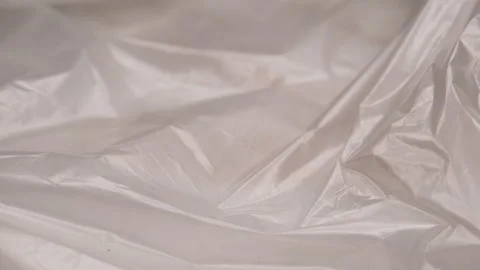 Distorted Transparency in Abstract Plastic Wrap with Intricate Creases Stock Footage 291379306