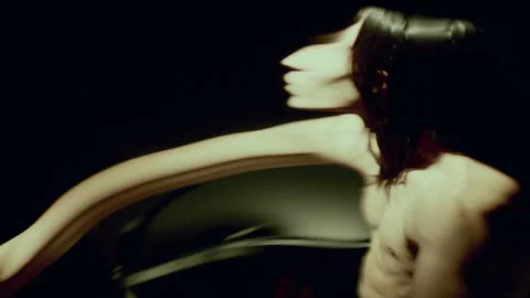 Distorting Mirror Reflection of Man with Bare Torso Moving in Dim Room Stock Footage 289882963