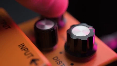 Distortion effect pedal knobs adjusting Video stock 119542075