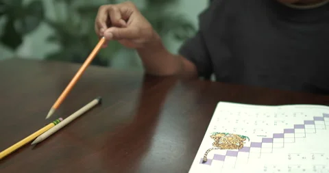 Distracted boy redirected back to homework Dolly Stock Footage 131687328