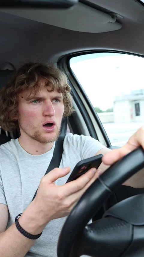 Distracted driver brakes suddenly after nearly causing a traffic accident Stock Footage 342920749