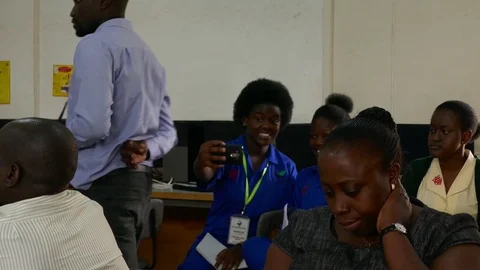 Distracted students taking selfie in  students, parents and teachers meeting Stock Footage 85131938