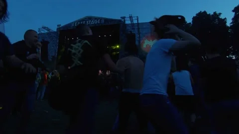 The distraught crowd is having fun to the music of their favorite band. Stock Footage 154158381