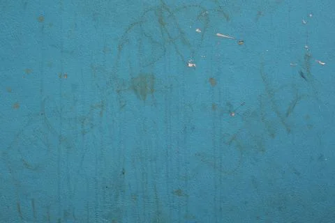 Distressed blue wall texture with scratches and weathered surface background Stock Photos