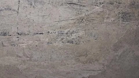 Distressed gray concrete surface with deep black scratches and texture Stock Photos