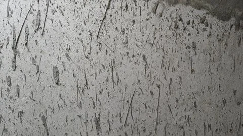Distressed grey concrete wall texture with dark scratches and weathered grunge Stock Photos