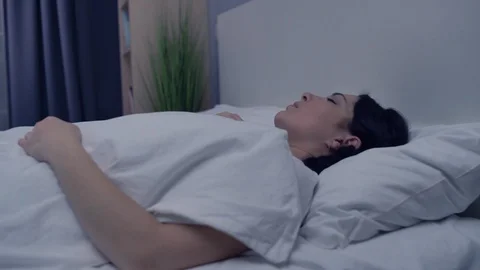 Distressed lady having sleep problems in bed, nightmares from stressful life Stock Footage 122500256