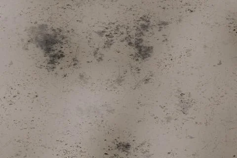 Distressed light beige surface with prominent dark gray splotches, numerous.. Illustrazione stock