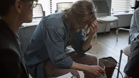 Distressed Man Sharing Problems during Group Therapy Session Stock Footage 337231201