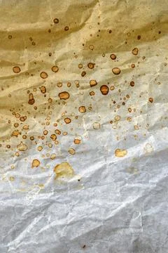 Distressed parchment paper with authentic coffee stains and natural wrinkle.. Stock Photos
