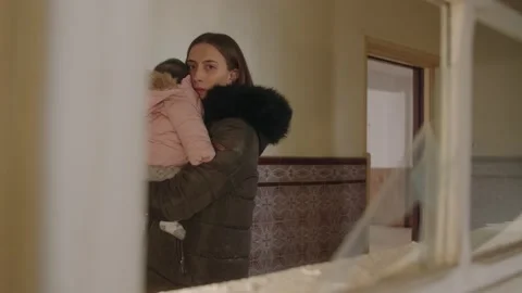 Distressed single mom worrying about safety of her child during Ukraine war Stock Footage