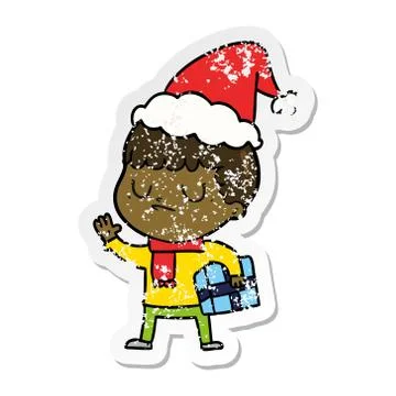 Distressed sticker cartoon of a grumpy boy wearing santa hat イラスト素材