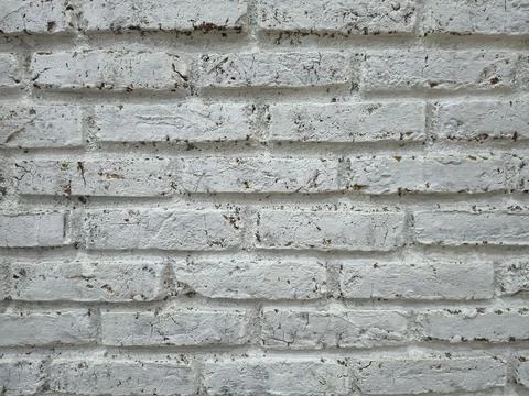 Distressed white painted brick wall texture background. Stock Photos
