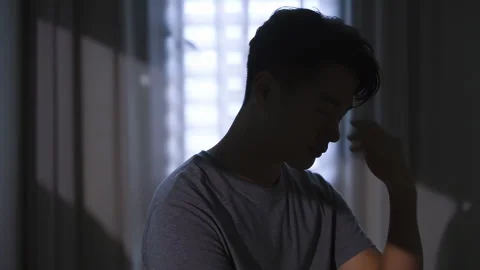 Distressed young husband man with hands on face looks worried and sad, showing Vídeo Stock 337723397