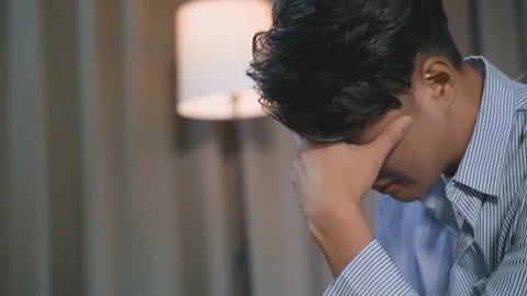Distressed young husband man with hands on face looks worried and sad, showing Vídeo Stock 337865991