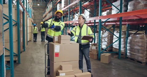 Distribution, argument or people in warehouse with clipboard, checklist and Stock Footage 335937214