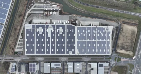 Distribution center filled with solar panels and a sustainable logistical Stock Footage 265657021