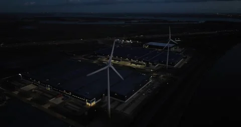 Distribution center at night. Logistics at night dusk. Sustainable windturbines Video stock 268863584