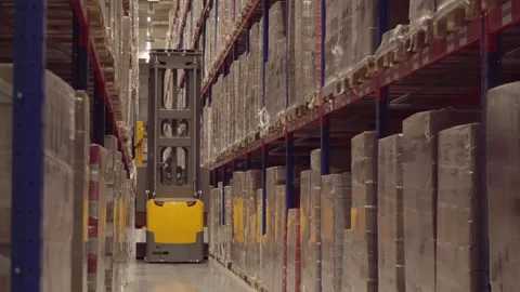 Distribution Center. Rows of shelves inside an industrial warehouse with boxes. Stock-Footage 249501188