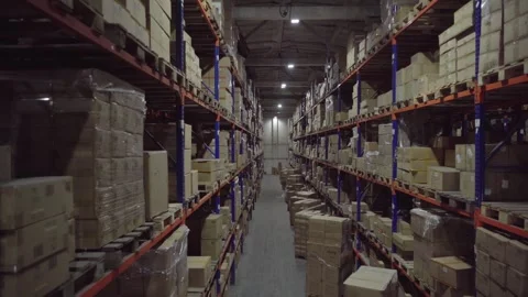 Distribution Center. Rows of shelves inside an industrial warehouse with boxes. 스톡 동영상 252033042