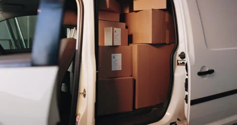 Distribution, delivery and cardboard boxes in empty van for inventory, export or 動画素材 341664370