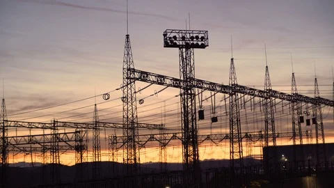 Distribution electric substation with power lines and transformers against Stock Footage 120455793