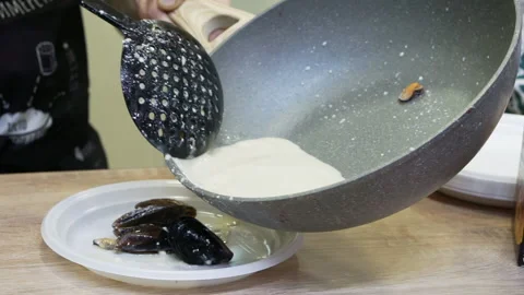 Distribution of mussels on serving plates. Stock Footage 171625107