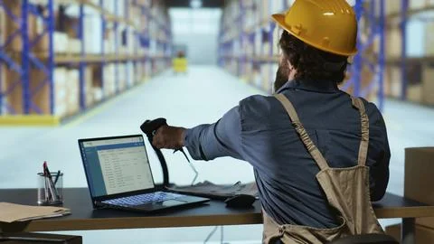 Distribution operations manager works with barcode reader 写真素材