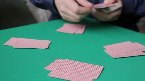 Distribution of playing cards on the green table Video stock 72200212