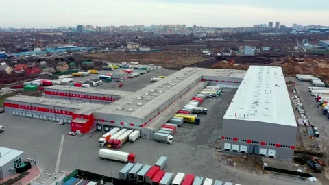 Distribution warehouse with trucks awaiting loading Stock Footage 156817303