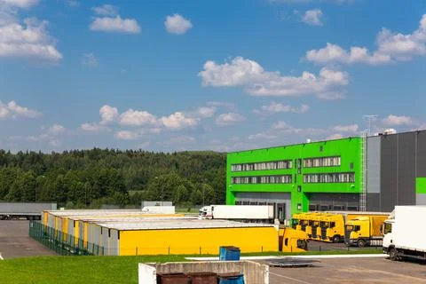 Distribution warehouse with trucks of different capacity. Fotos Stock