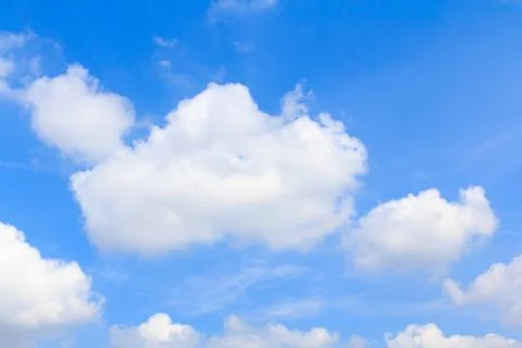 Distribution of white clouds on the clear blue sky for background texture Stock Photos
