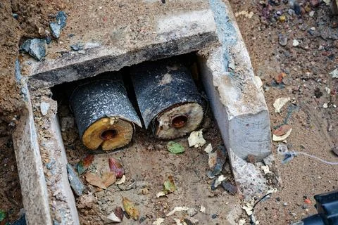 District heating pipes exposed during renovation work on construction site Stock Photos