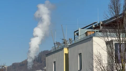 District heating plant smoke stack with apartment building Stock Footage 323800814