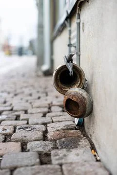 Disused pipe coupling formerly used to receive beer from tank truck. Disus... Stock Photos