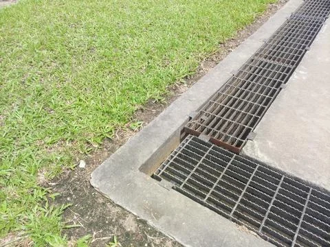Ditch covered with grating. abstract background Stock Photos